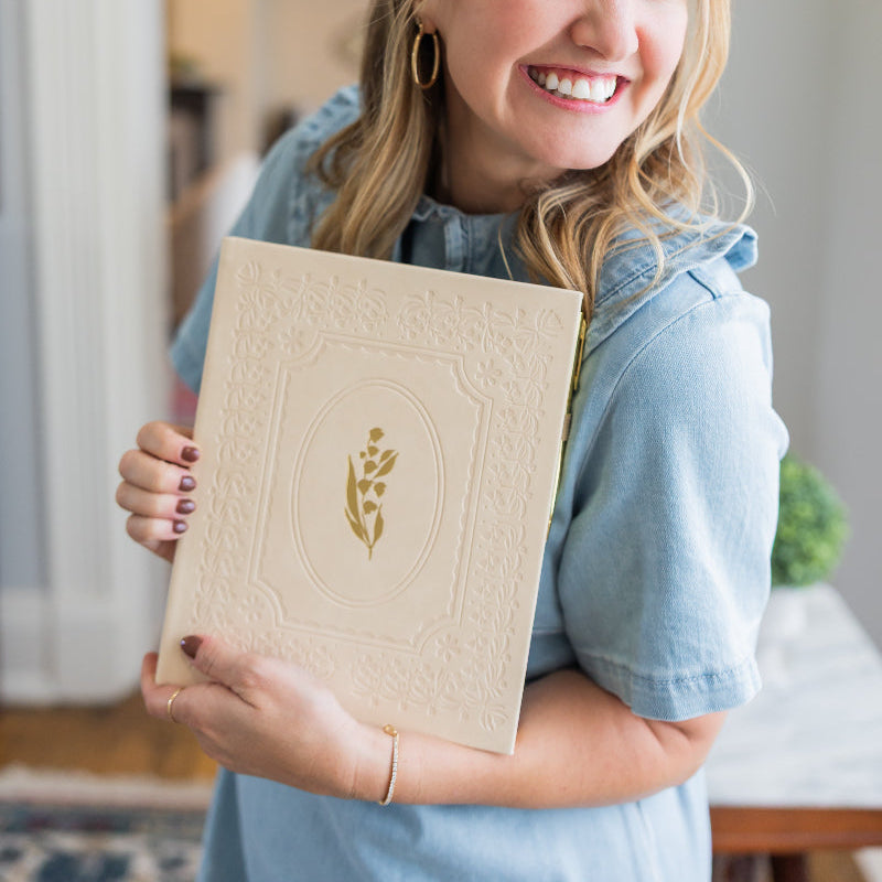 Woman holding Selah's 2026 daily planner.